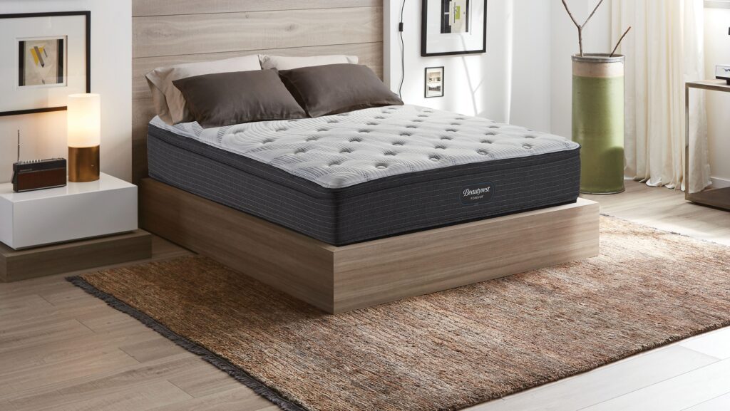 Beautyrest Forever Hybrid mattress in a well-lit bedroom.