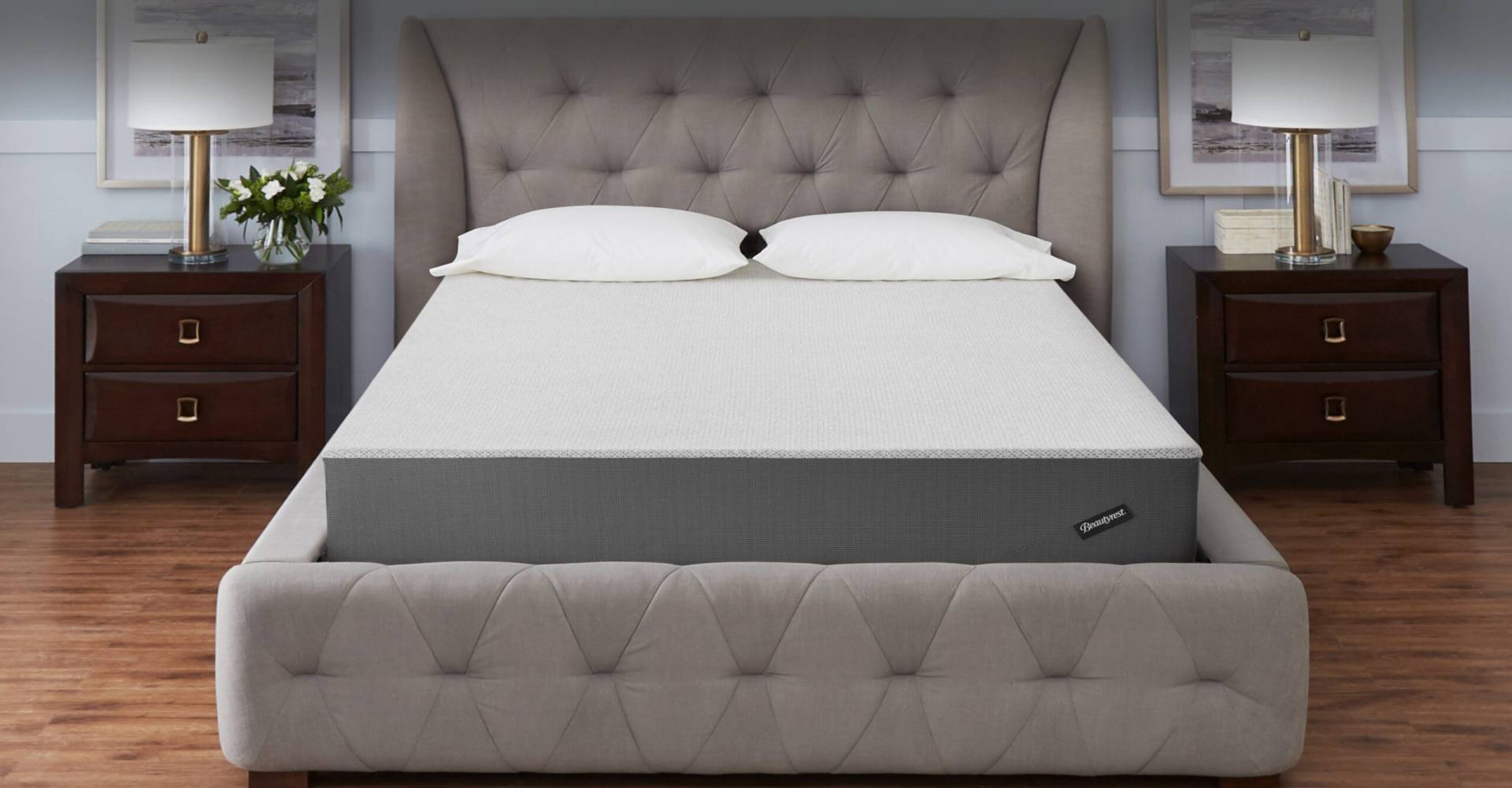 Beautyrest Mattress in a Box in a well-lit bedroom between two bedside tables with lamps. 